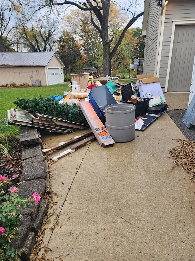 Dumpster being loaded with debris for Estate Cleanout Dumpster Rental in Vineyards